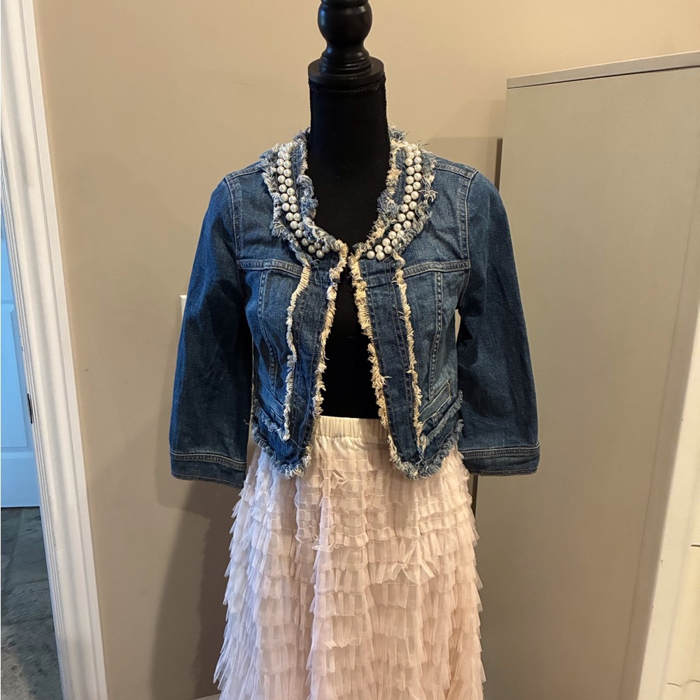 Vera Wang cropped jean jacket with pearl detail.